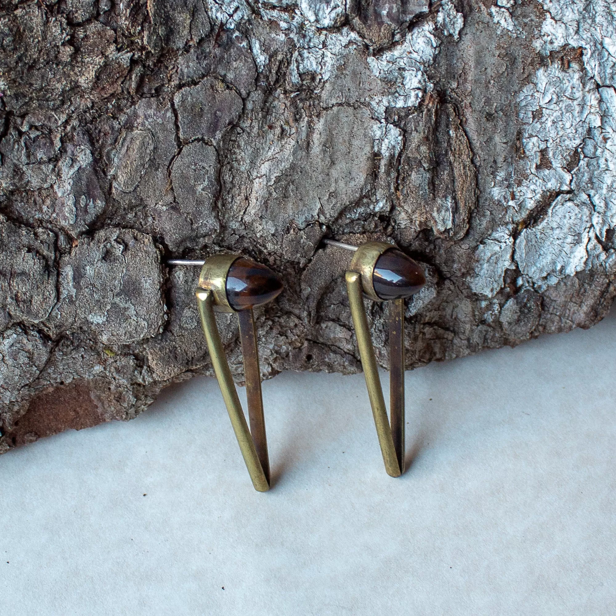 Bullet stud earrings with tiger eye cabochon.