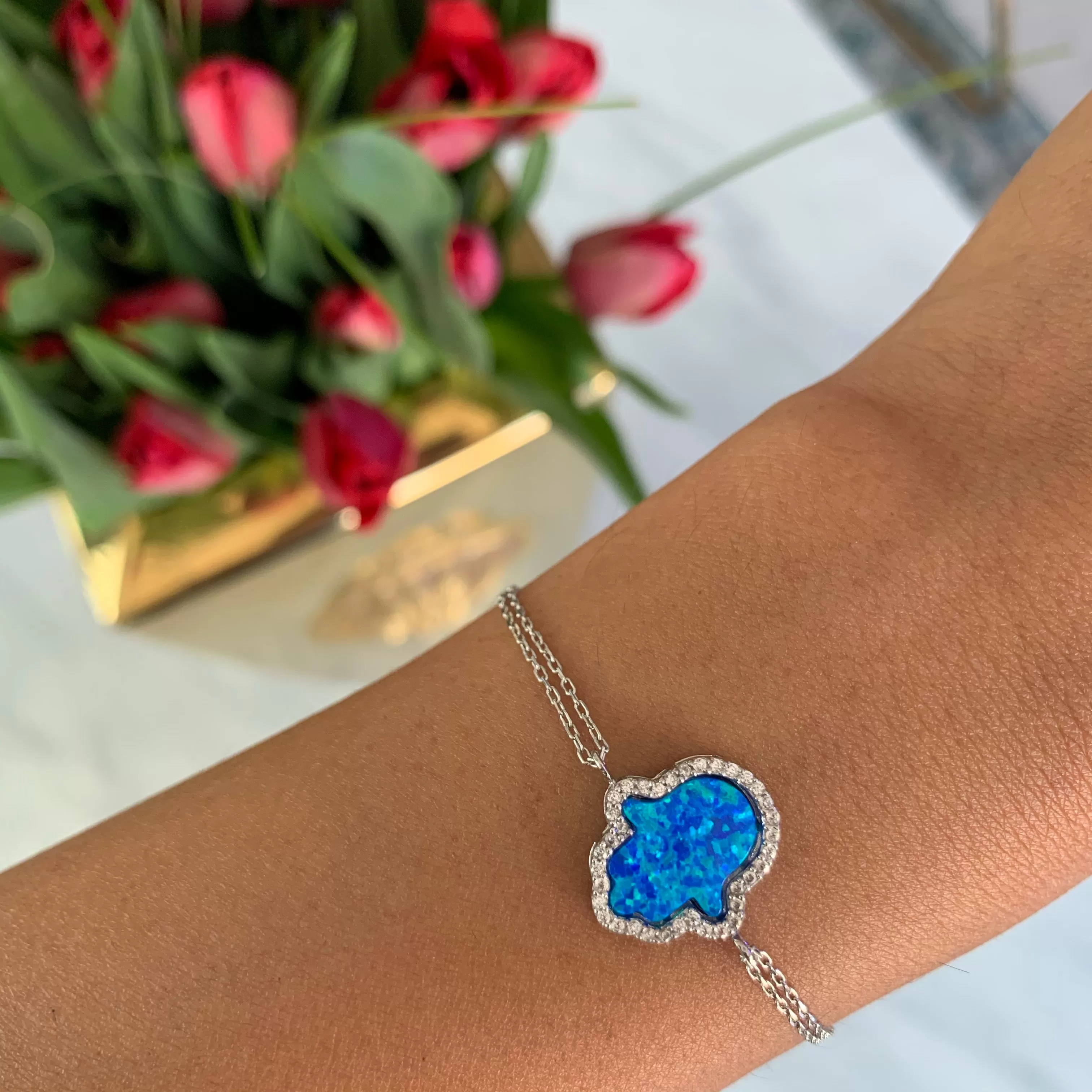 Sterling silver blue opal hamsa bracelet